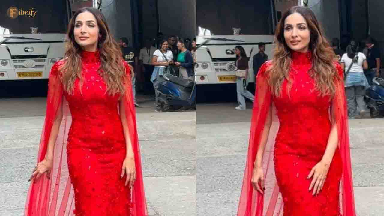 Malaika Arora slays in a bright red riding hood with an embellished red caped gown.